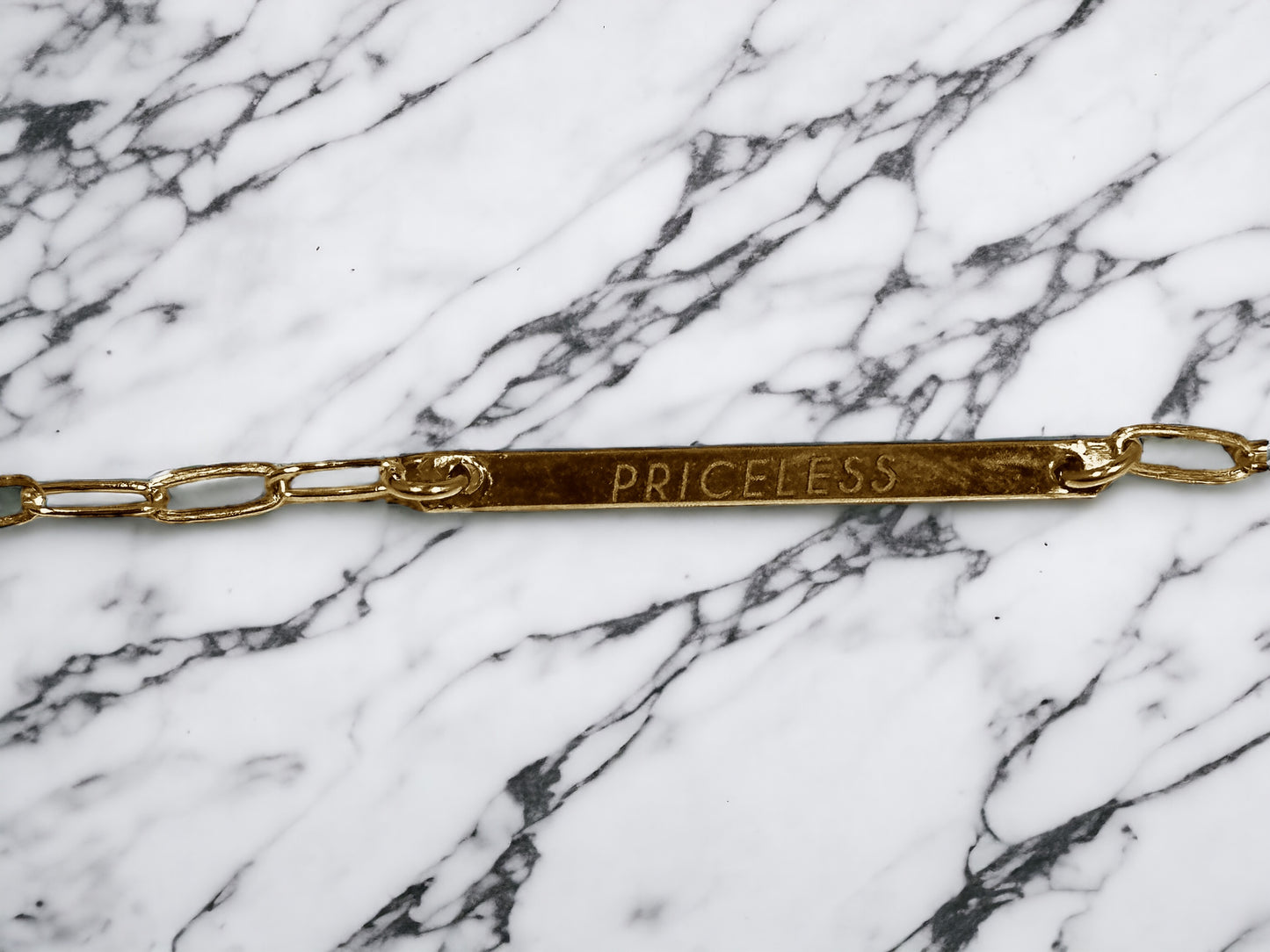 "PRICELESS,” Gold Limited Edition Plain Solid Bar with AAA CZ dangle.